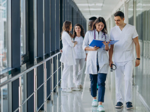 team-young-specialist-doctors-standing-corridor-hospital_1303-21202